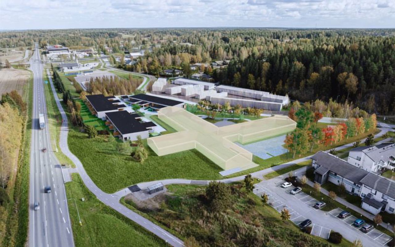 Ilmakuva suunnitellusta rivitalosta visualisointikuva istutettu kuvaan.