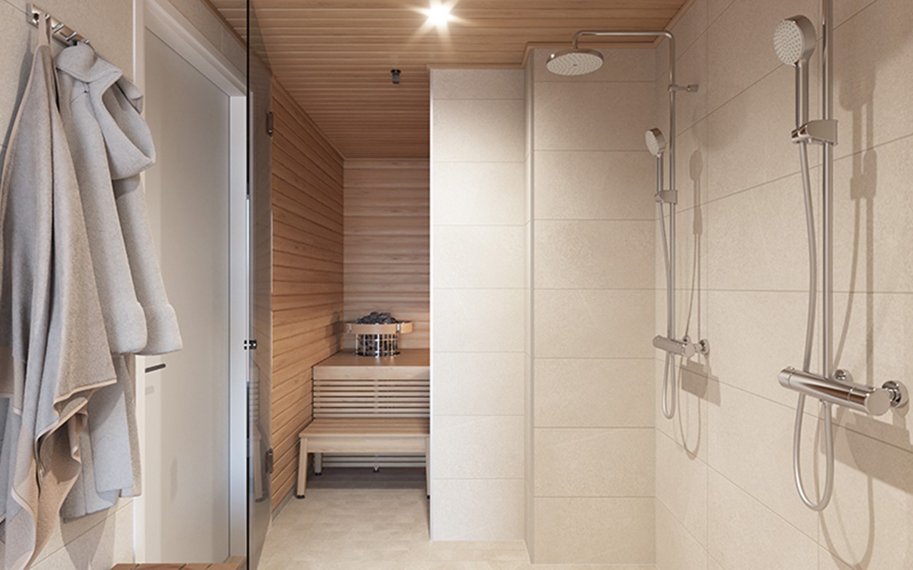 Luonnoskuvanäkymä asunnon A45 pesutiloista ja tyylikkäästä saunasta